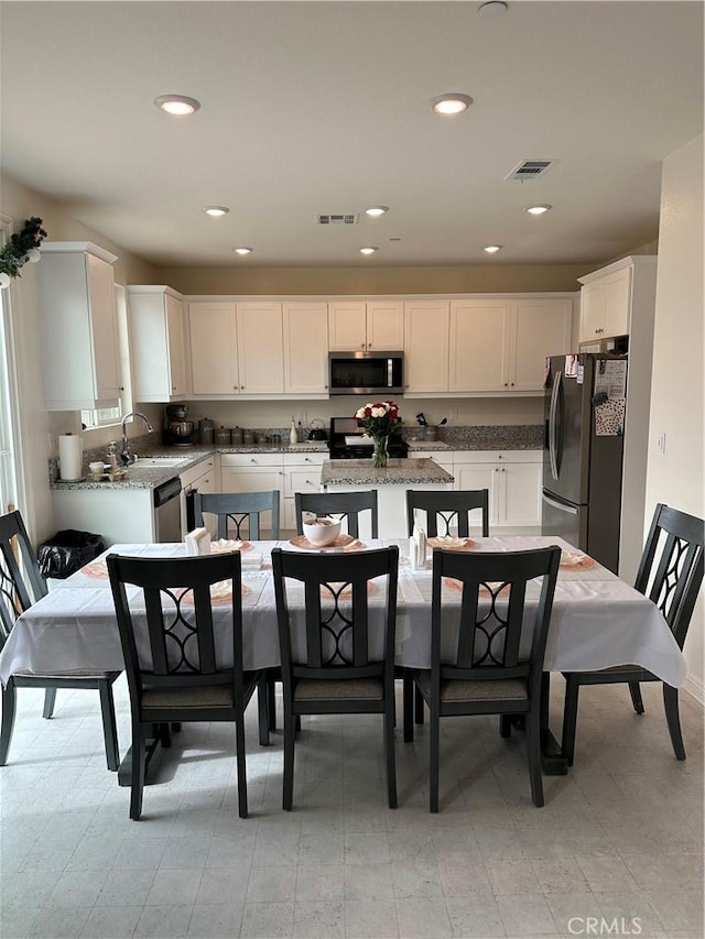 dining area featuring sink