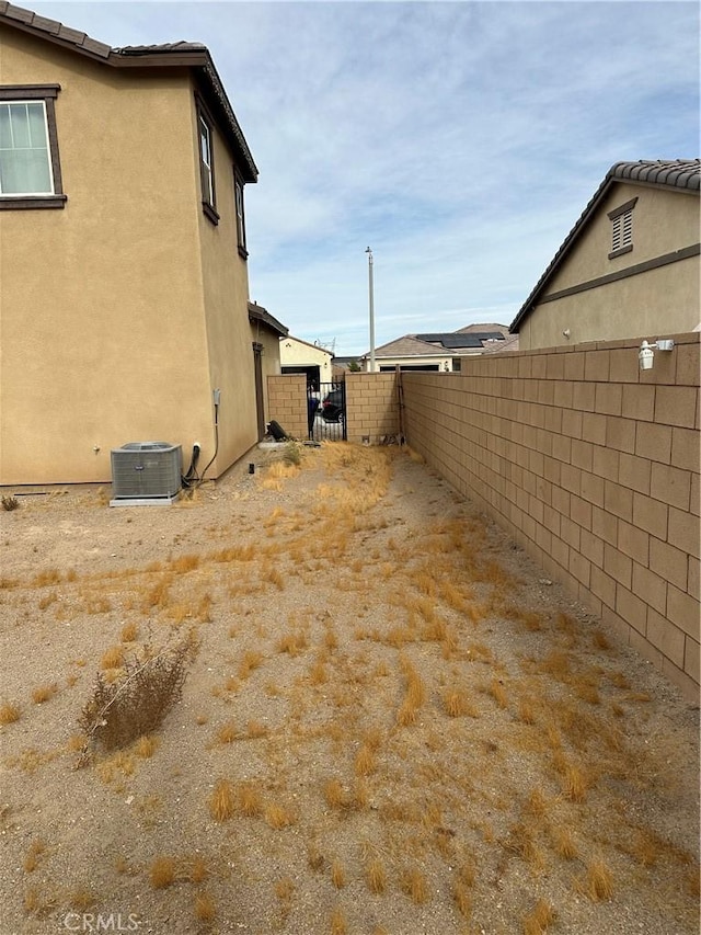 view of yard featuring central AC