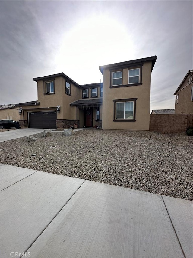 rear view of house featuring a garage