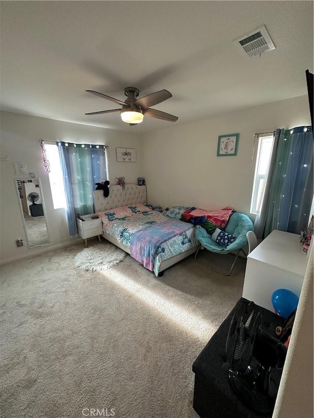 bedroom featuring ceiling fan and carpet flooring