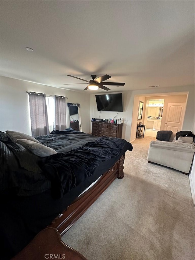 bedroom with ceiling fan and carpet floors