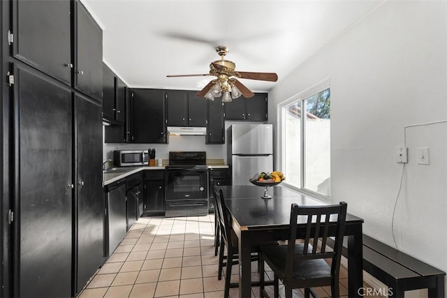 kitchen with ceiling fan, light tile patterned floors, and stainless steel appliances