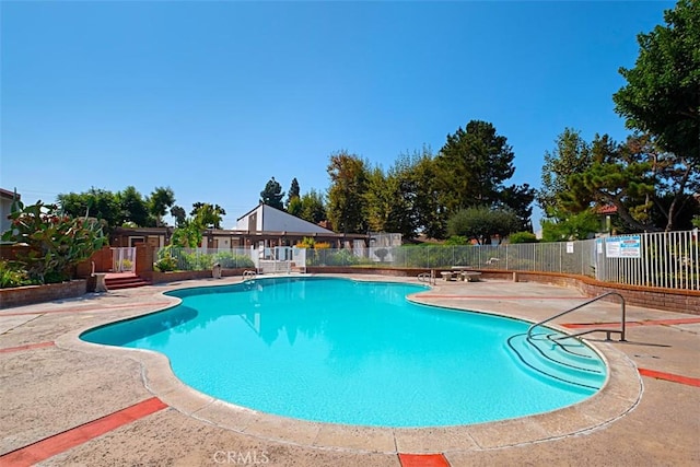 view of pool featuring a patio