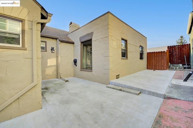 view of property exterior featuring a patio