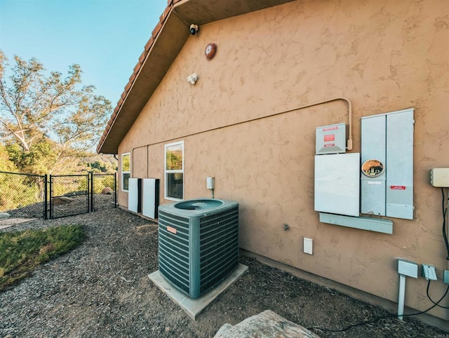 view of home's exterior with central AC unit