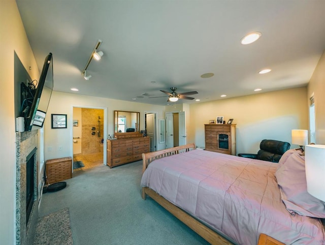 carpeted bedroom featuring track lighting