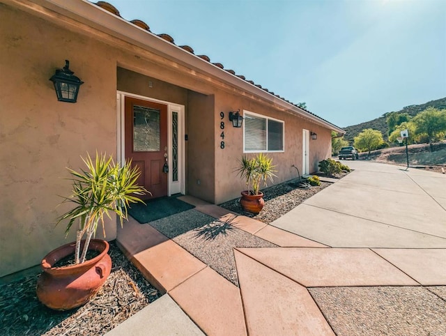 doorway to property featuring a mountain view