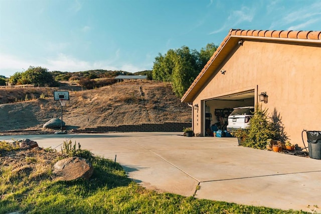 view of property exterior featuring a garage