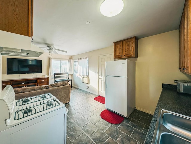 kitchen featuring ceiling fan, sink, cooling unit, and white appliances