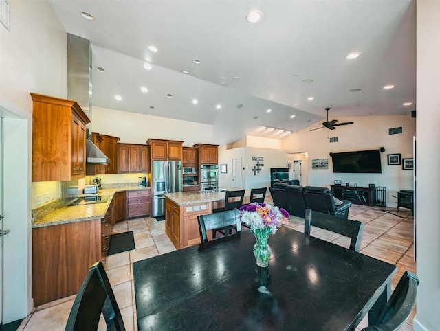 dining area featuring ceiling fan, high vaulted ceiling, and light tile patterned floors