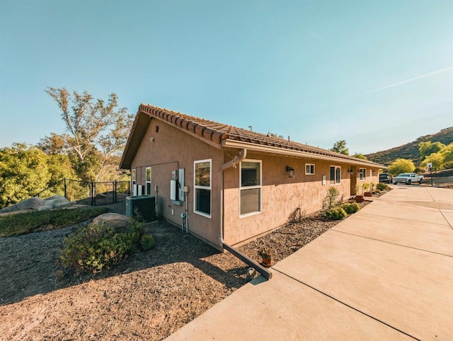 view of property exterior with central air condition unit