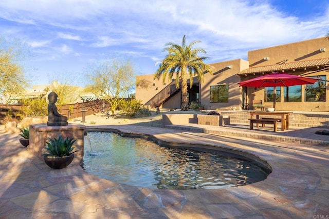 view of pool featuring a patio