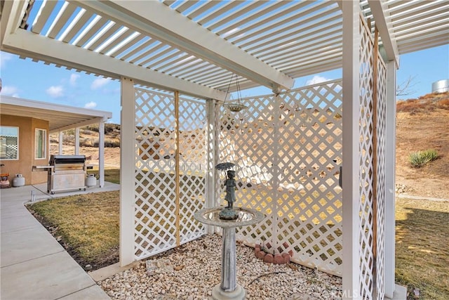 view of patio / terrace featuring a grill and a pergola