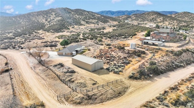 birds eye view of property featuring a rural view and a mountain view