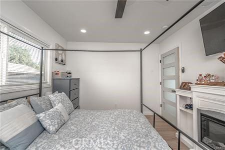 bedroom featuring ceiling fan and wood-type flooring