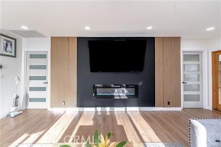 unfurnished living room featuring light hardwood / wood-style flooring