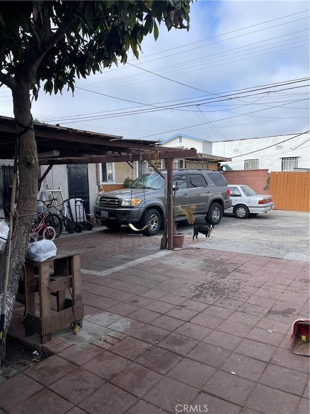 view of parking with a carport