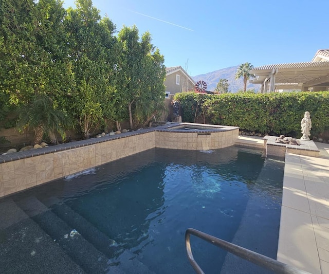 view of pool featuring an in ground hot tub, a mountain view, and a pergola