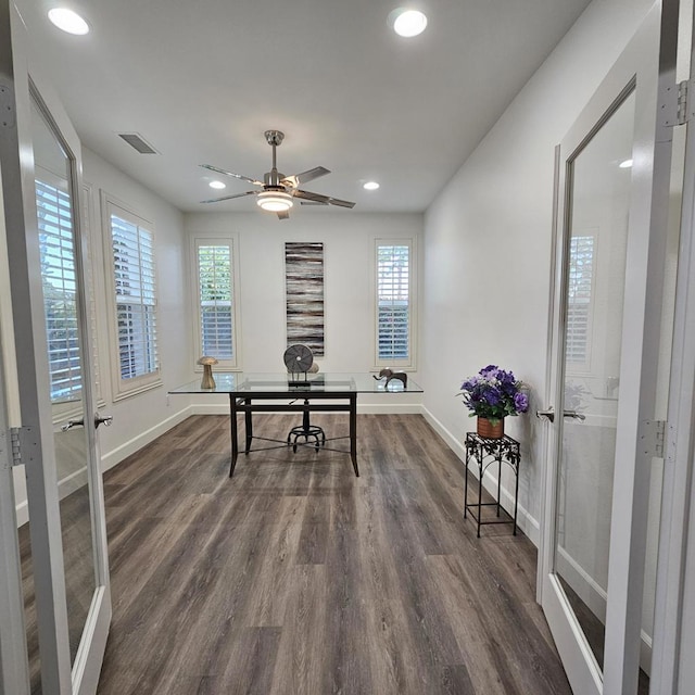 office area featuring ceiling fan and dark hardwood / wood-style flooring