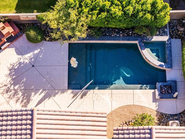 view of pool featuring an in ground hot tub and a patio