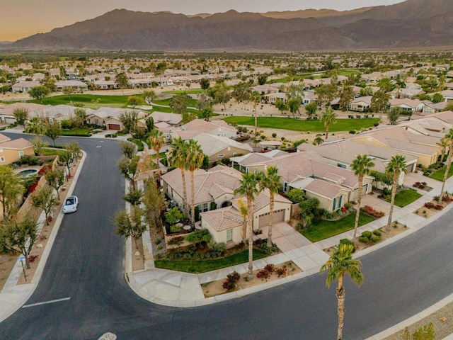 birds eye view of property with a mountain view