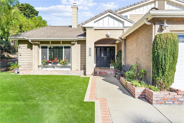 entrance to property with a yard