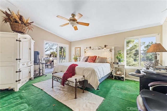 bedroom featuring ceiling fan, carpet, crown molding, and lofted ceiling