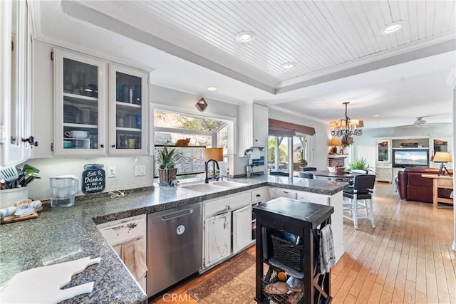 kitchen featuring wooden ceiling, white cabinets, stainless steel dishwasher, and crown molding