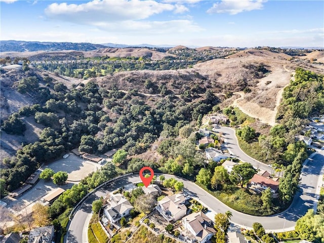 drone / aerial view featuring a mountain view