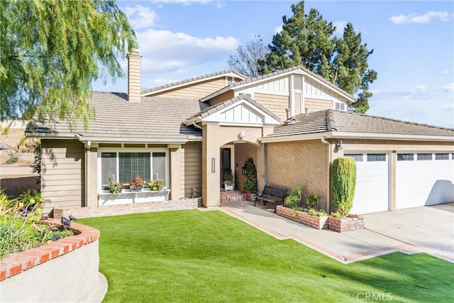 view of front of house with a front lawn and a garage