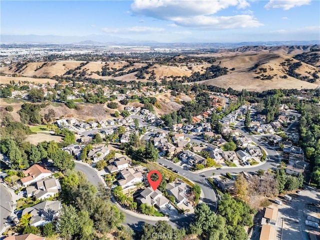 birds eye view of property with a mountain view