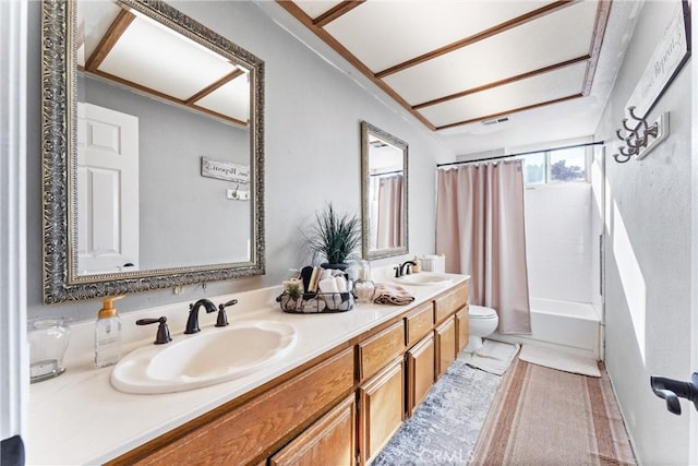 full bathroom with toilet, vanity, and shower / bath combo with shower curtain