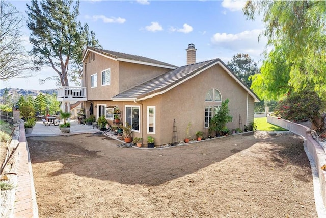 rear view of house featuring a patio area