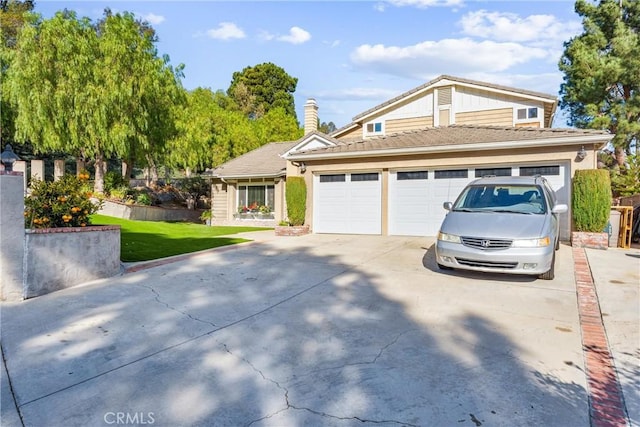 view of front facade with a garage and a front yard