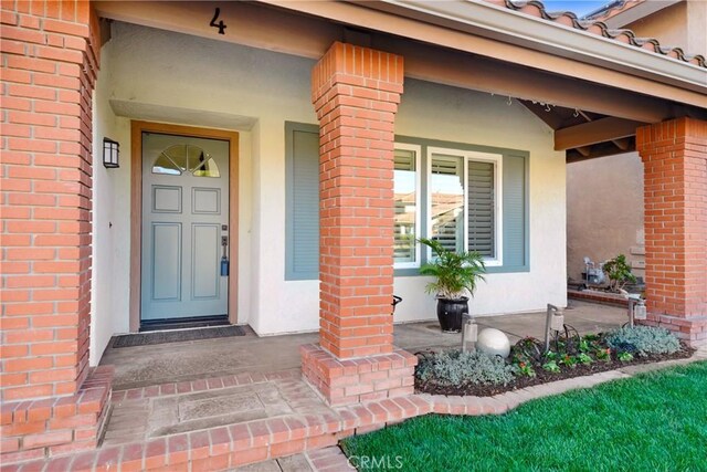 doorway to property featuring a porch