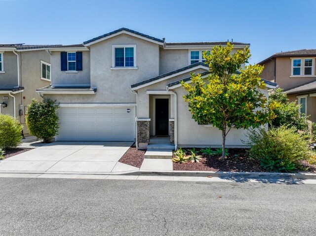 front of property featuring a garage