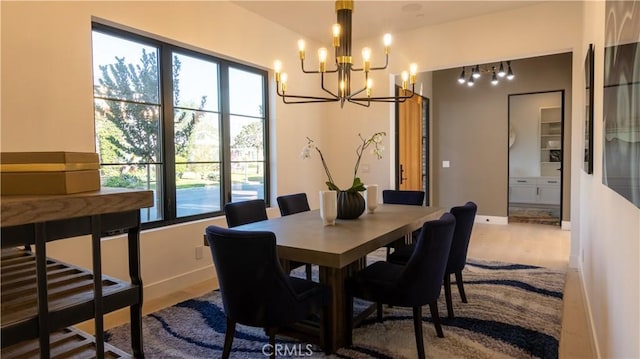 dining room featuring a notable chandelier and hardwood / wood-style flooring