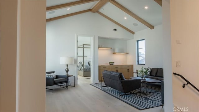 living room featuring high vaulted ceiling, light hardwood / wood-style flooring, and beamed ceiling