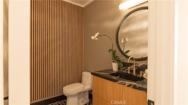 bathroom featuring toilet and vanity