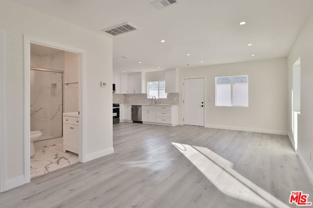 interior space with sink and light wood-type flooring