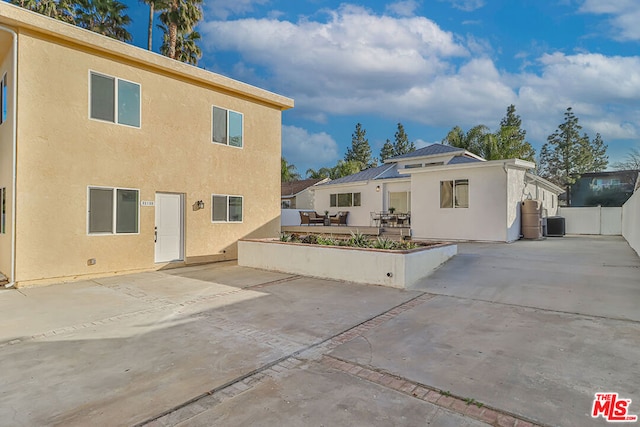 back of house featuring a patio