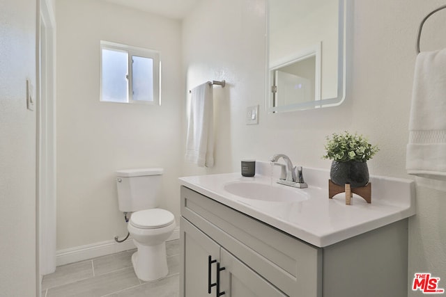 bathroom with toilet and vanity