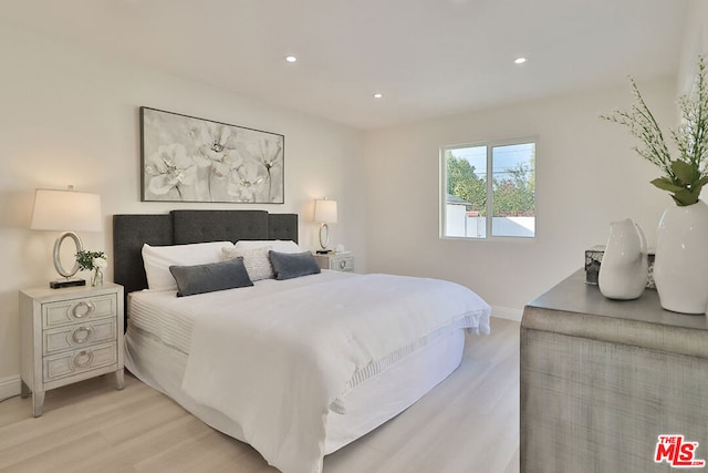 bedroom with light hardwood / wood-style floors