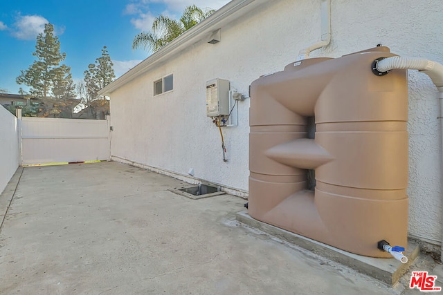 view of property exterior with a patio