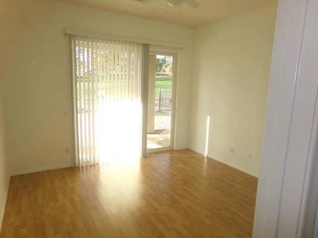 spare room featuring ceiling fan and hardwood / wood-style floors