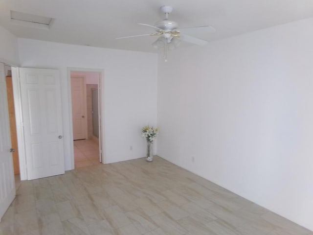 unfurnished room with ceiling fan