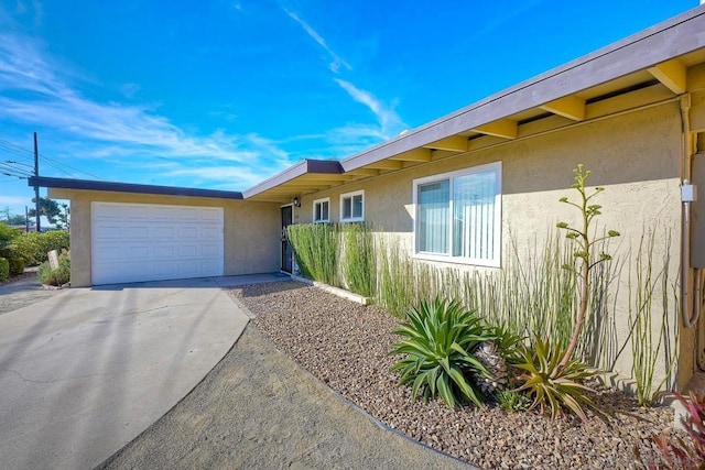 ranch-style home featuring a garage