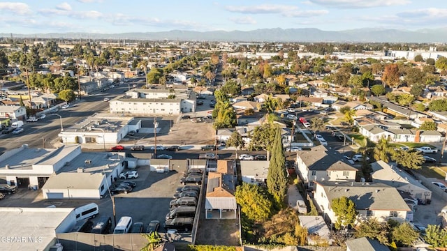 birds eye view of property featuring a mountain view