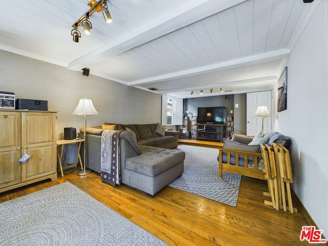 living room with dark hardwood / wood-style flooring and beamed ceiling