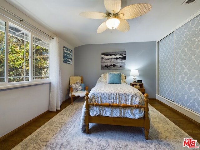 bedroom featuring lofted ceiling, hardwood / wood-style floors, and ceiling fan